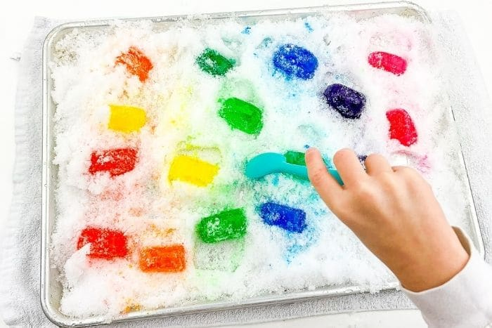 snow and rainbow ice sensory play